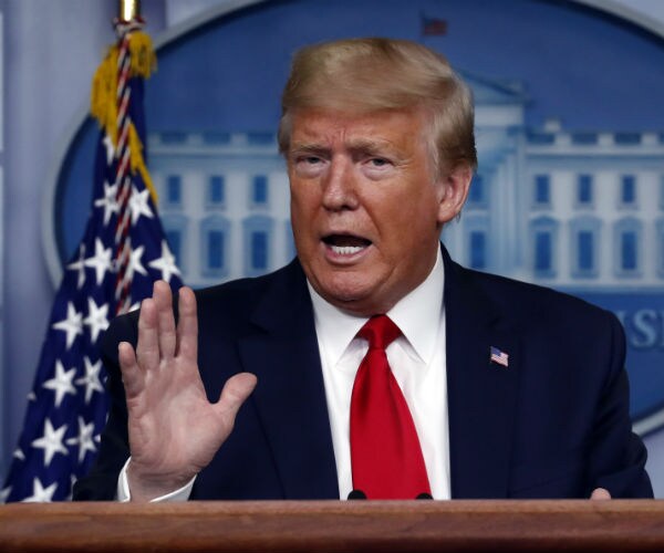 donald trump is shown during a white house briefing on coronavirus