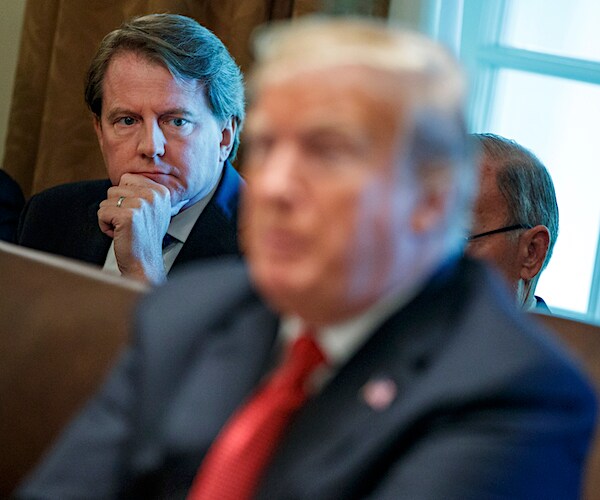 don mcgahn stares down president donald trump over the president's right shoulder