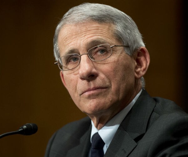 dr. anthony fauci is in dress suit and tie