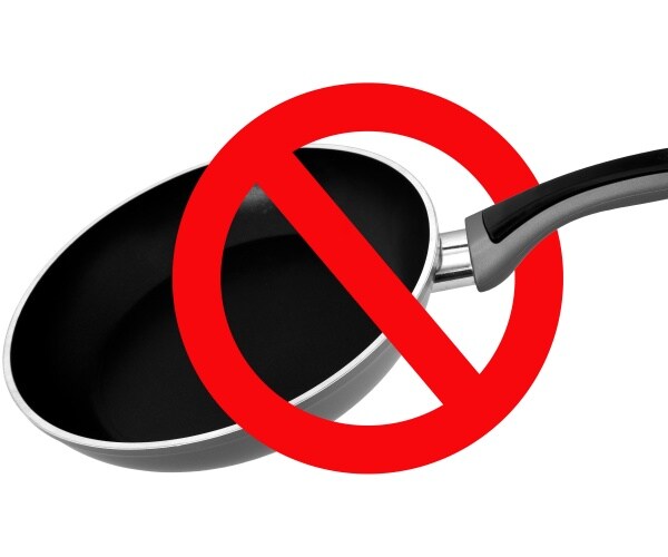 illustration of nonstick frying pan with red circle with line through it, not to use it because of pfas chemicals