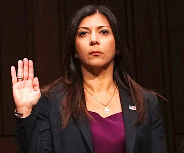 Dr. Lina Alathari raises her right hand while being sworn in for congressional testimony