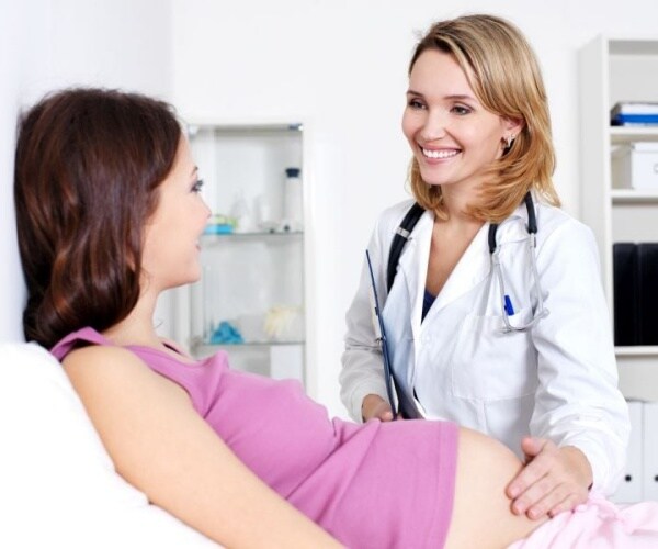 pregnant woman at doctor's appointment