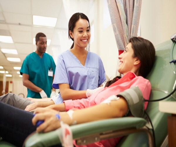 A woman receiving blood in the hospital