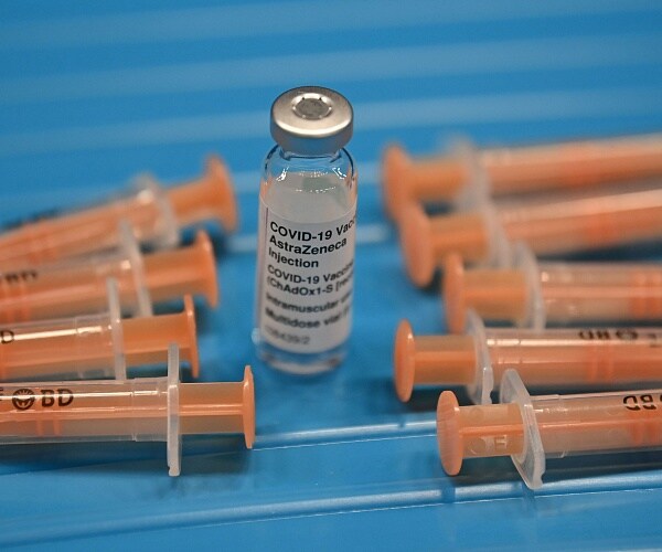 astrazeneca coronavirus vaccine and syringes