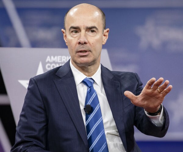 labor secretary eugene scalia gestures with his left hand as he speaks at the cpac conference