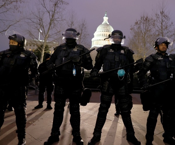 police in riot gear outside the capitol