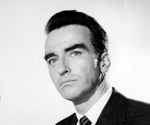 clift in a suit and striped tie