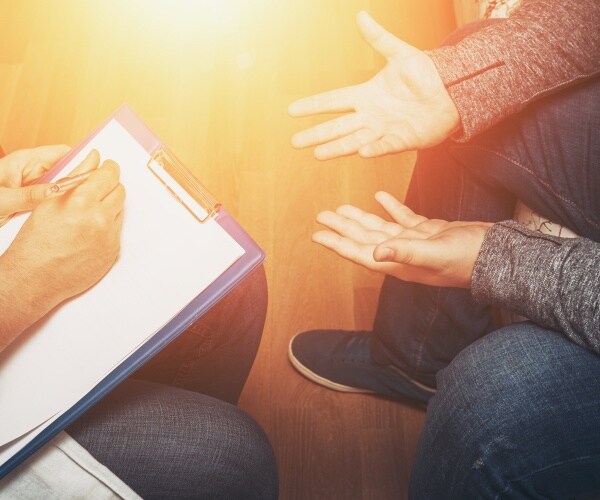 psychologist talking to a patient