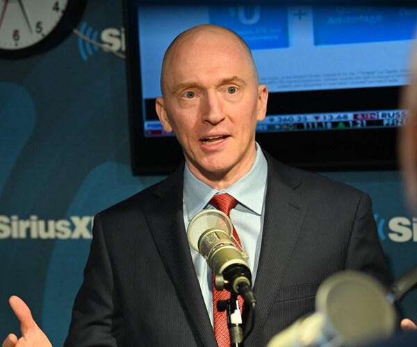 carter page is interviewed in a radio studio.