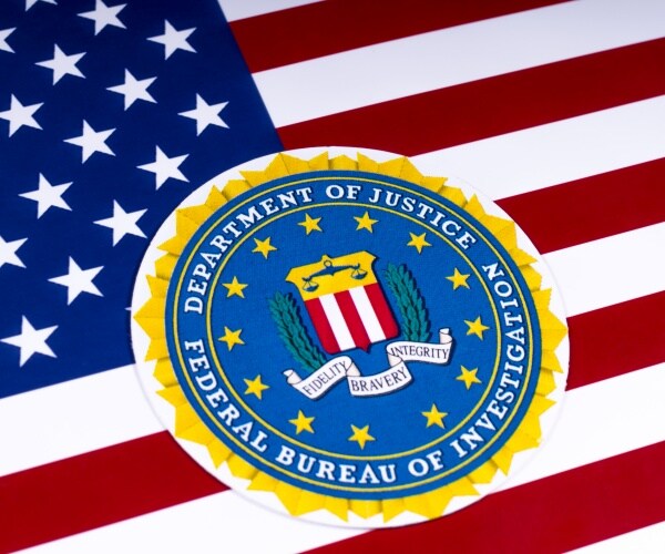 symbol of the federal bureau of investigation, portrayed with the us flag