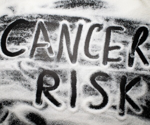 Cancer Risk spelled out in sugar spread on a table