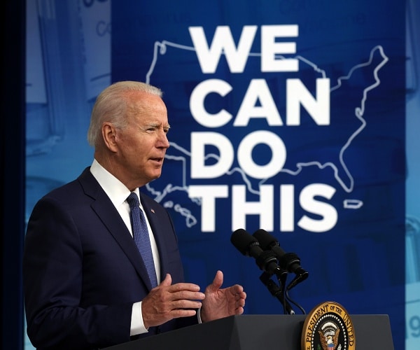 joe biden speaks into mic