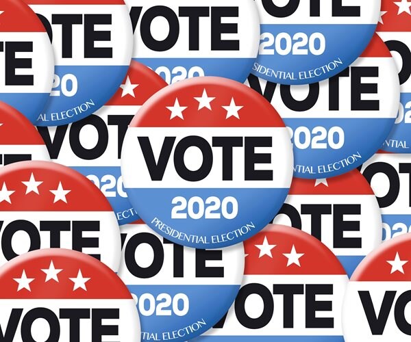 photo shows red, white, and blue campaign buttons with the slogan vote 2020 presidential election