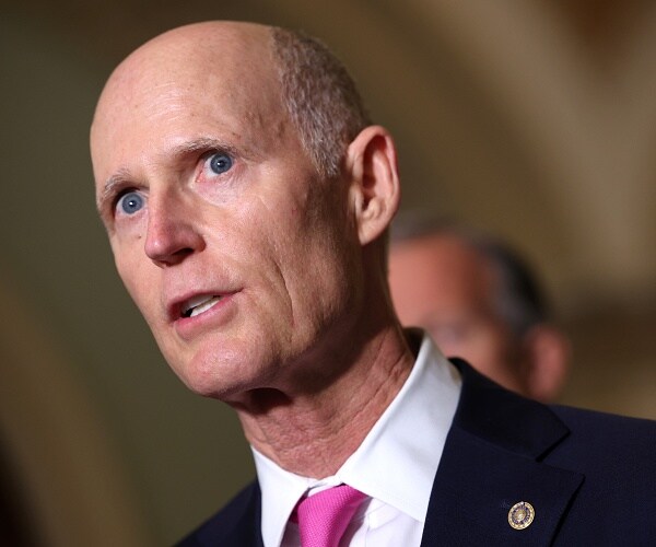 rick scott speaks to press