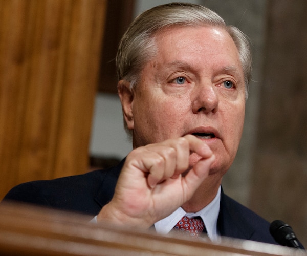 south carolina republican senator lindsey graham pinches his left index finger to his thumb while delivering remarks