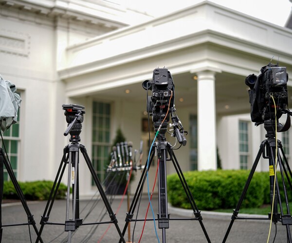 Cameras pointed at an entrance to the West Wing of the White House