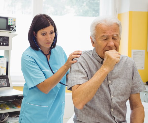 a doctor checks on a patient