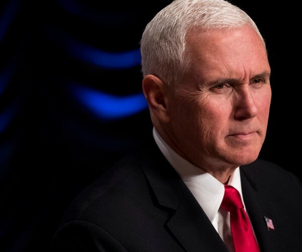 vice president mike pence looks forward stoically