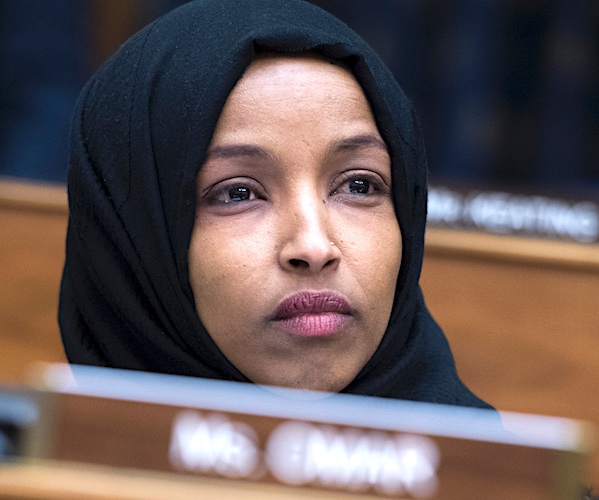 ilhan omar listens during a house committee hearing