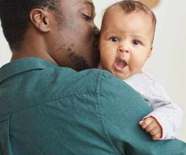 Dad holding baby