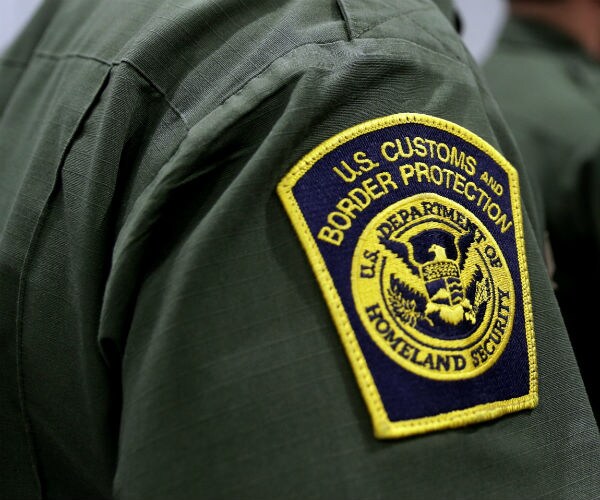 the border patrol patch is shown on the shoulder of a border patrol officer