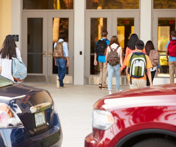 students arriving at school in morning