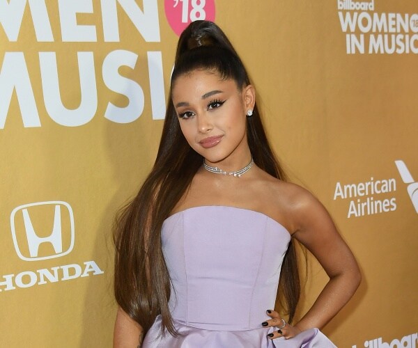 ariana grande in a light pink dress and necklace