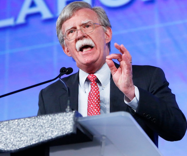 john bolton gestures as he speaks during a convention