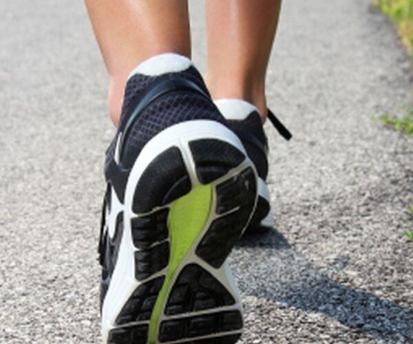 close-up of sneakers on woman walking