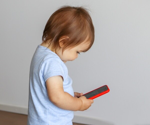 baby looking at screen on smartphone