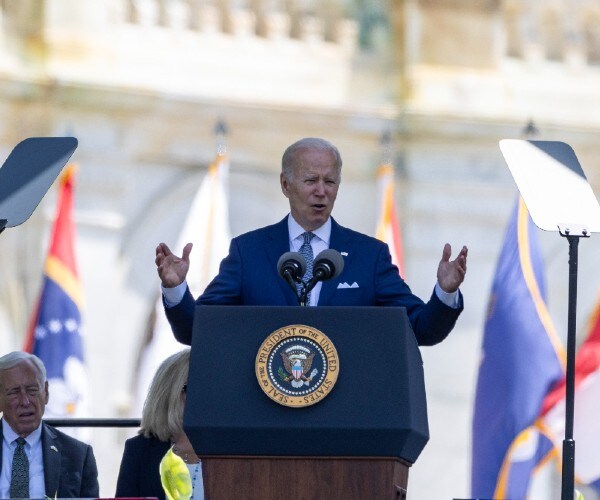 Joe Biden speaks from behind a podium at the U.S. Capitol