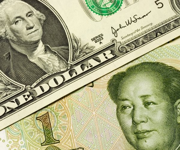 closeup of us and chinese currency 

