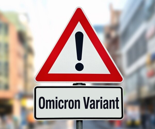 street sign warning Omicron with exclamation point