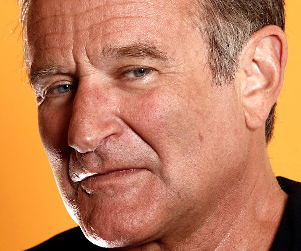 actor robin williams poses for a photo before his untimely death