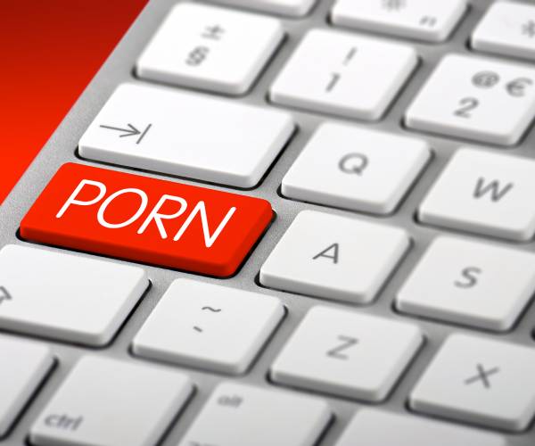 a computer keyboard with a button labeled porn