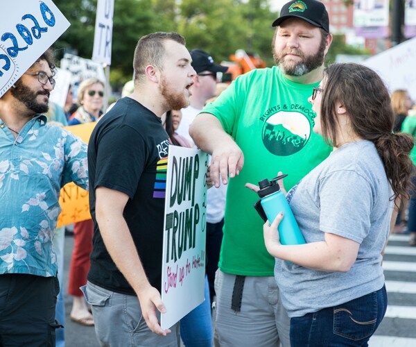 Opposing protesters square off in Manchester, New Hampshire