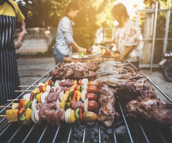 people bbqing outside