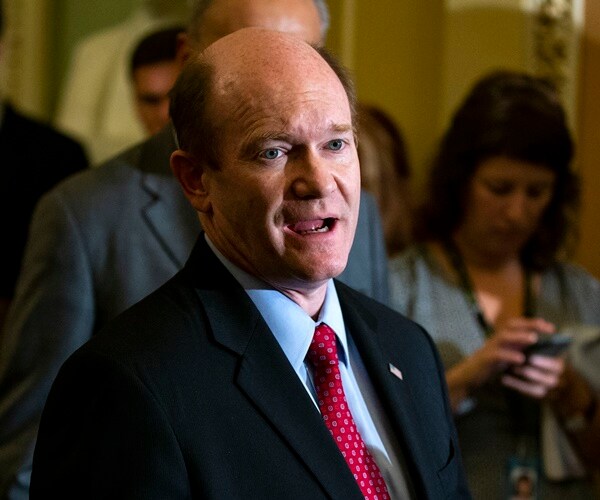 sen. chris coons speaks with the press