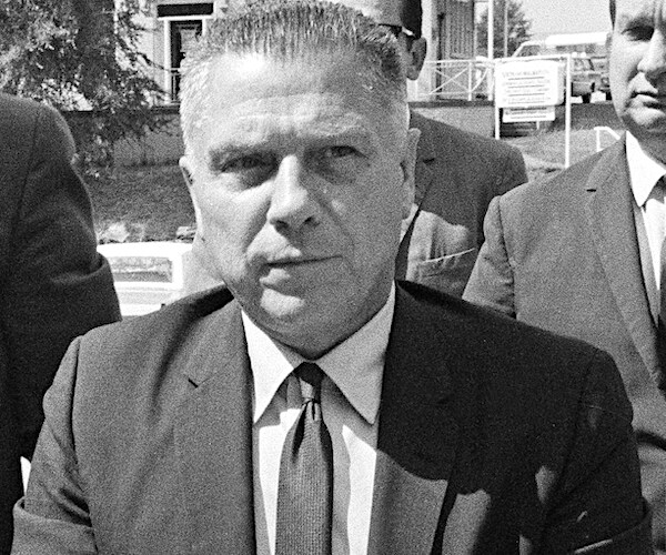 Jimmy Hoffa is escorted by federal agent, arrives at the Hamilton County Jail in Chattanooga, Aug. 14, 1969