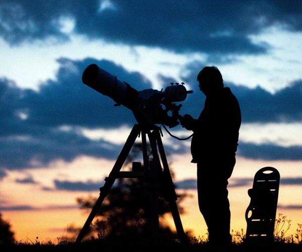 A man with a telescope in Austria