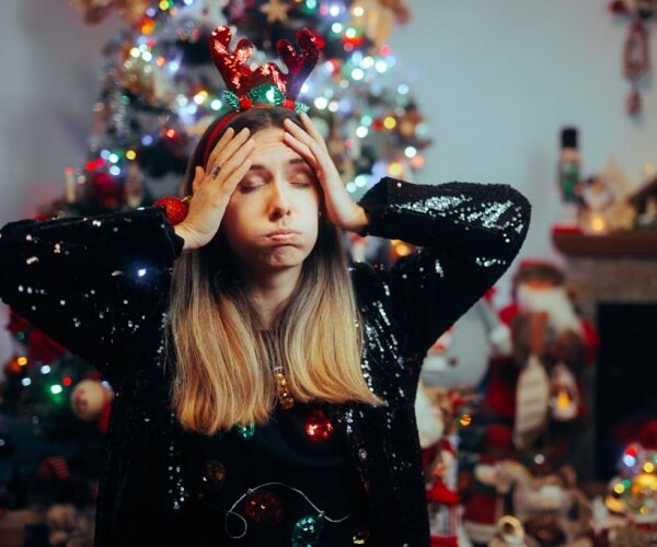 woman looking stressed out about holidays