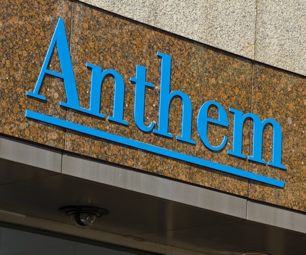 anthem coprorate logo in blue on brown building facade