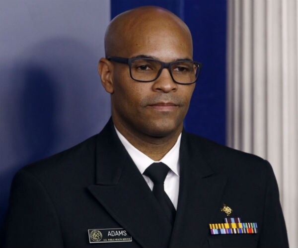 Surgeon General Jerome Adams is seen in uniform at the white house