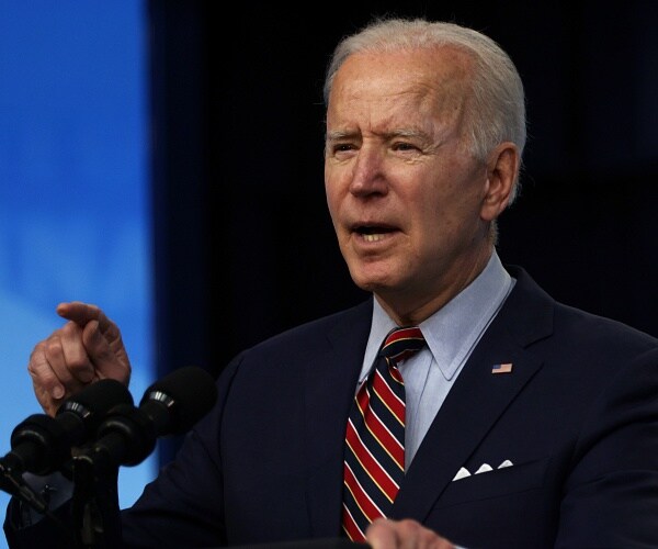 joe biden speaks into mic