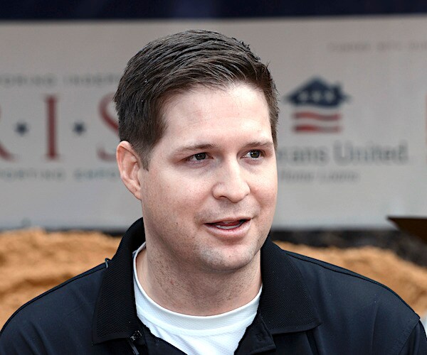 brian kolfage speaks to the media during a groundbreaking ceremony