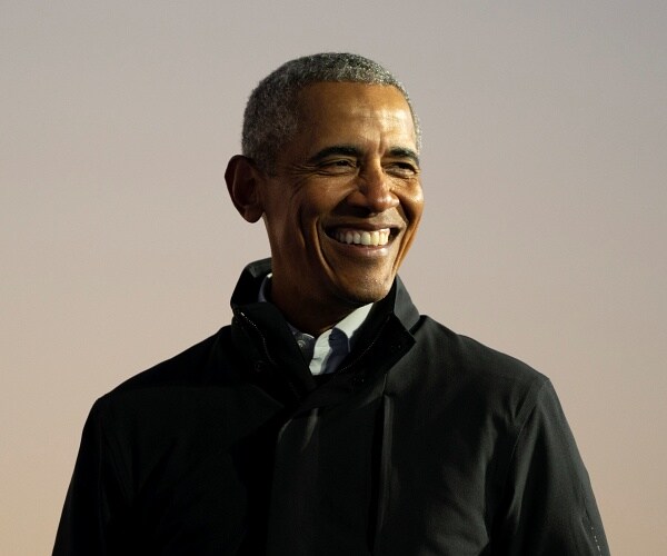 barack obama smiles onstage