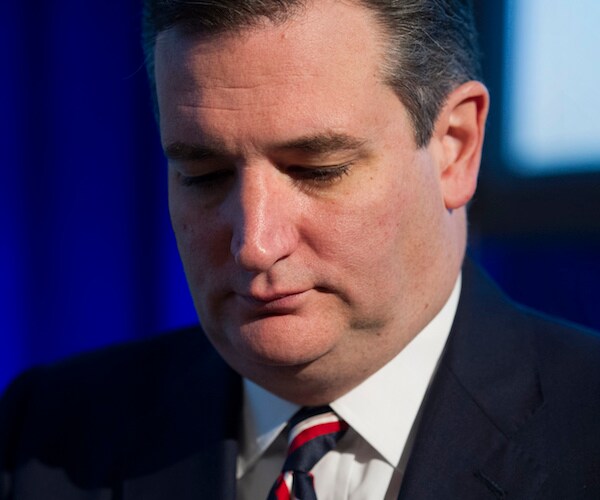 ted cruz bows his head in disgust