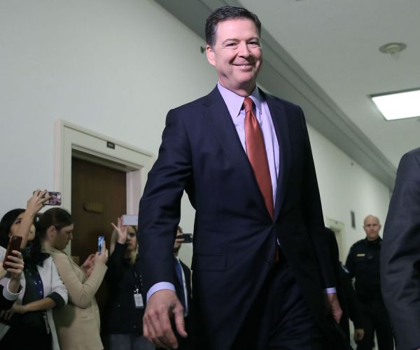 comey on sunday tweeted a photo of himself with the caption, 'so many questions' after barr's summary was released