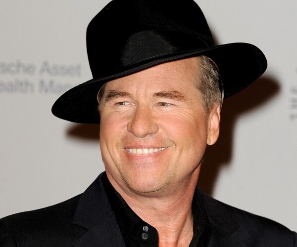 val kilmer stands on red carpet