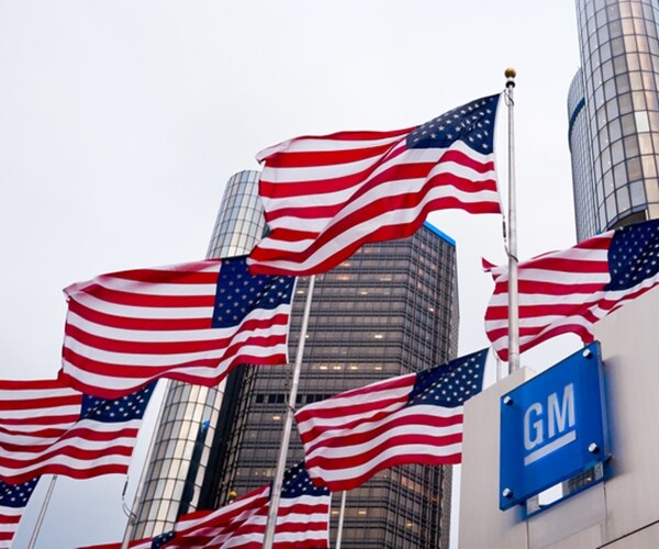 american flags outside gm general motors building